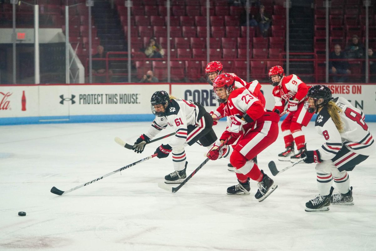 Junior forward Lily Brazis skates ahead of Boston University. The Huskies met their rival at Matthews Arena Oct. 11, 2024, clinching a 4-0 shutout only to be given the same score backwards the next day when the tables turned in BU’s home rink.