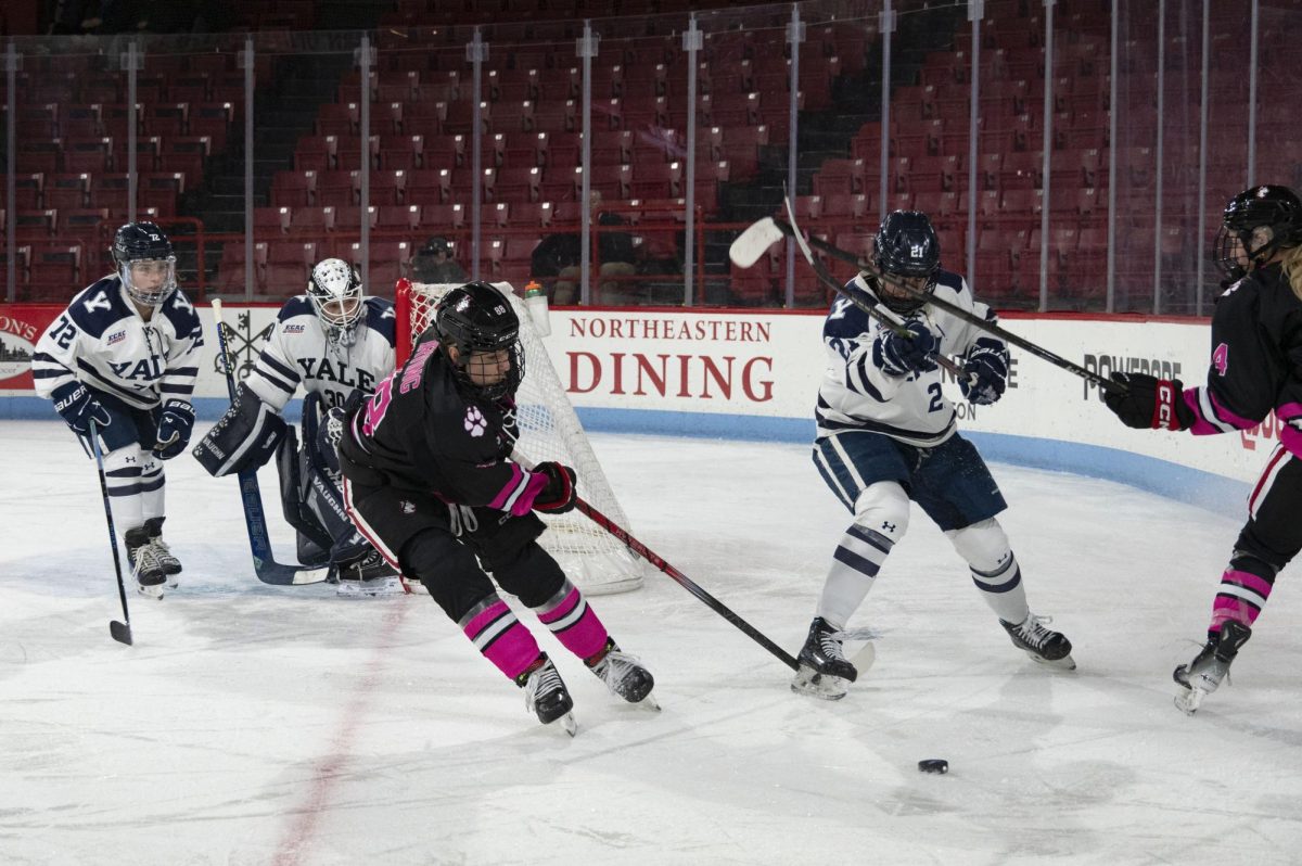 Skylar Irving fights for the puck Jan. 7. Irving collected a goal and an assist against Merrimack Jan. 25.