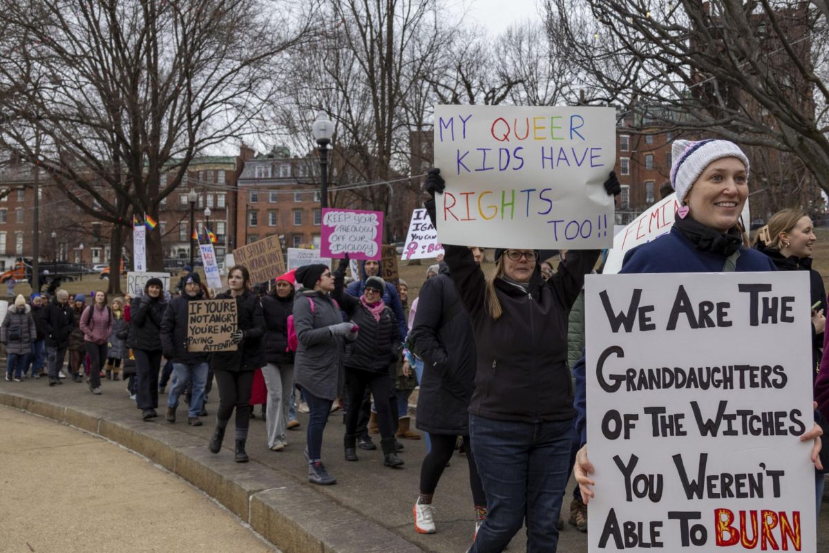 Protesters hold up signs during the Women’s March in Boston Common Jan. 18. Read more here.