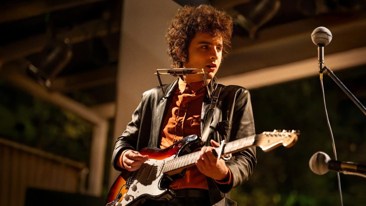 Timothée Chalamet plays the guitar in "A Complete Unknown." A "Complete Unknown" followed the early years of Bob Dylan's career, from New York City in 1961 to the Newport Folk Festival in 1965. Photo courtesy Searchlight Pictures.