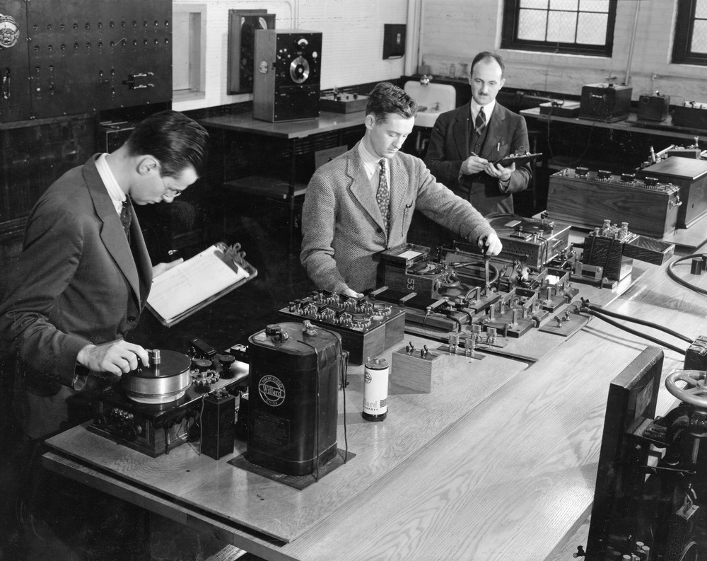 Early co-op students use electrical equipment at their job. U.S. News ranked Northeastern as the No. 1 school for co-ops and internships. Photo courtesy Northeastern University Archives and Special Collections.