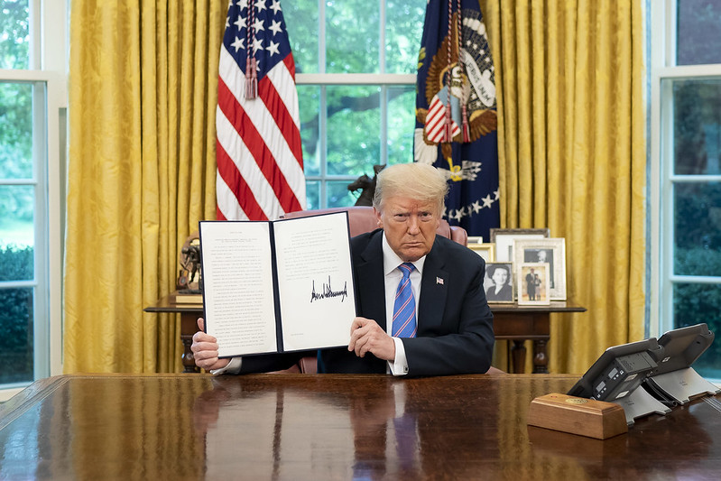 Donald Trump shows his signature after signing an executive order June 26, 2020. He signed one rescinding several other executive orders that strengthened the Equal Employment Opportunity Act shortly into his second term. Photo courtesy
Tia Dufour, Flickr..