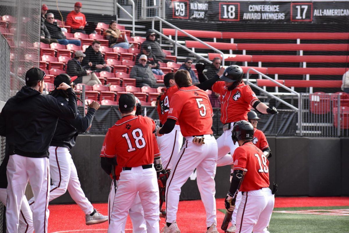 The team celebrates a run March 12, 2024. The Huskies split their opening weekend in a double header against Charlotte 49ers Feb. 14.