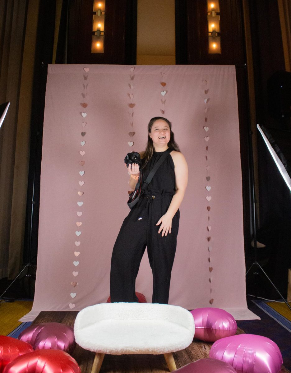 Lauren Peet smiles in front of her pet photography studio set-up. As part of the festivities, Boston Dog Moms partnered with Peet of LP Photography for the first time Feb. 1, offering professional dog portraits to commemorate the occasion.