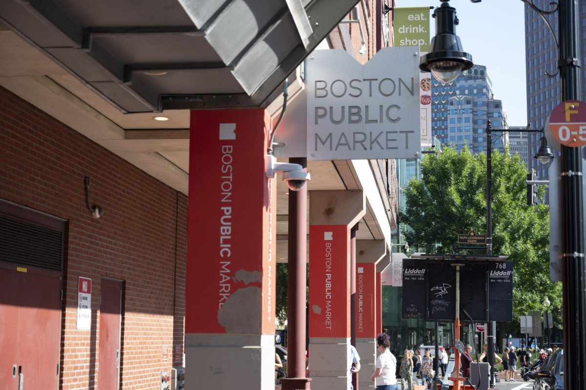 Signs line the outside of the Boston Public Market.