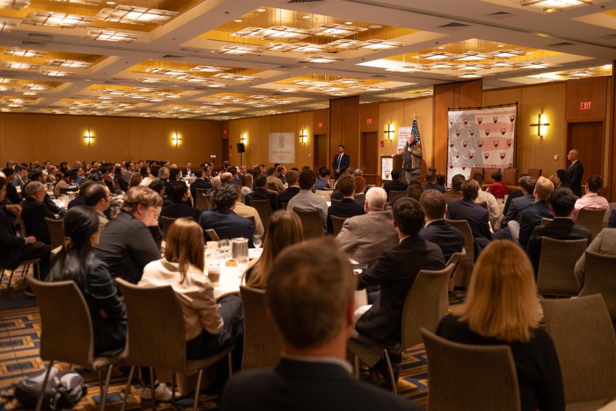 Harvard Conservative and Republican Student Conference attendees sit and listen to Steve Bannon. The conference included several keynote speakers and panels.