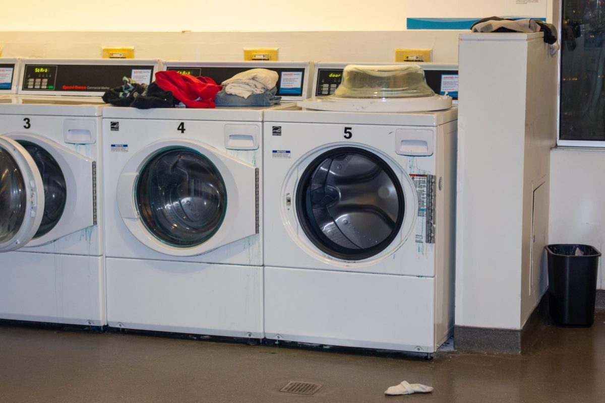 A washing machine with the door removed in International Village. An email was sent out Feb. 21 asking students to stop removing the doors.