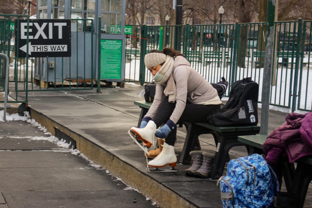 An attendee unties her skates after the class. Skates were the only monetary expense for the class; they were available to rent on-site for $15.