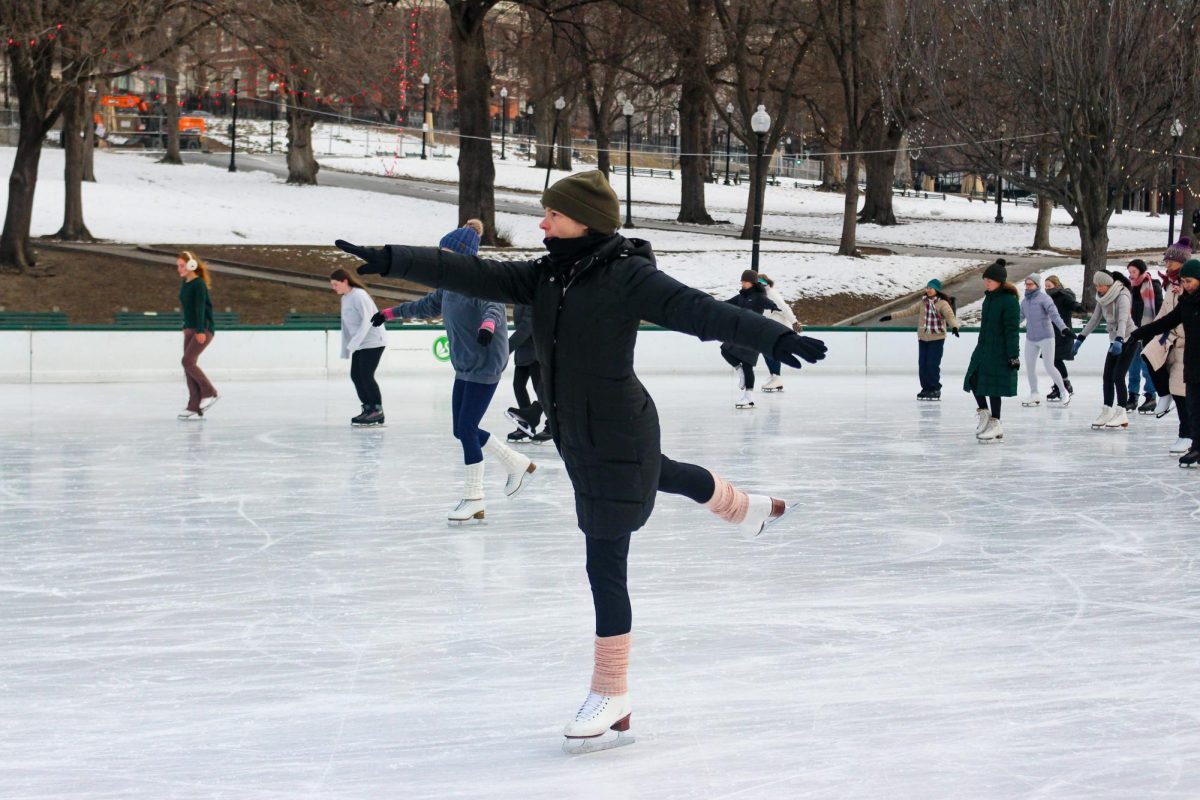 A class attendee glides across the ice on one skate. Some attendees were on one skate, some were on two and others used support seals or other accommodations.