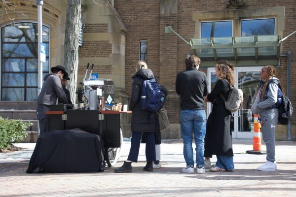 Attendees wait in line for free coffee from Coffee Trike. The event was a welcome midday break for employees in nearby hospitals.