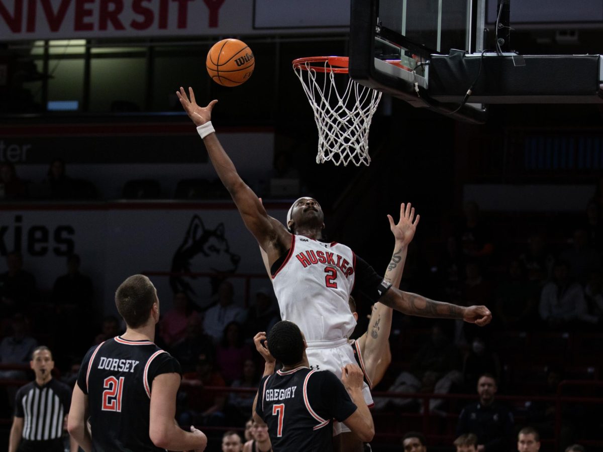 Alexander Nwagha attempts to push the ball back into the basket. Nwagha had two steals and two blocks against the Campbell Camels Jan. 13.