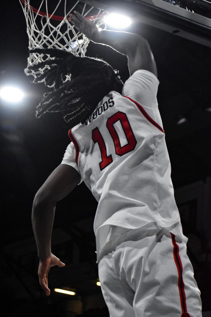 Harold Woods gets a basket Feb. 8. The Huskies comfortably held on to the Feb. 15 win, giving the team its 15th victory of the season.