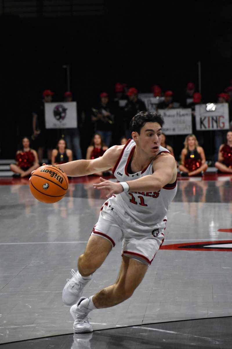 JB Frankel rushes down the court. Northeastern struggled to solidify a defensive effort Feb. 8, which ultimately led to the disappointing loss to Hampton.