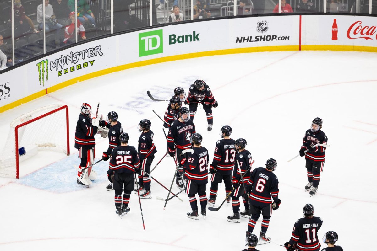 Quinton Sigurdson greets his team Feb. 10. Siguardson had his first career start, shutout and assist Feb. 14.