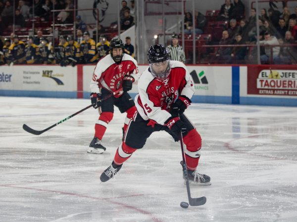 Jack Henry handles the puck as he skates down the ice. The team lost to Maine 3-1 in their second matchup of the season.