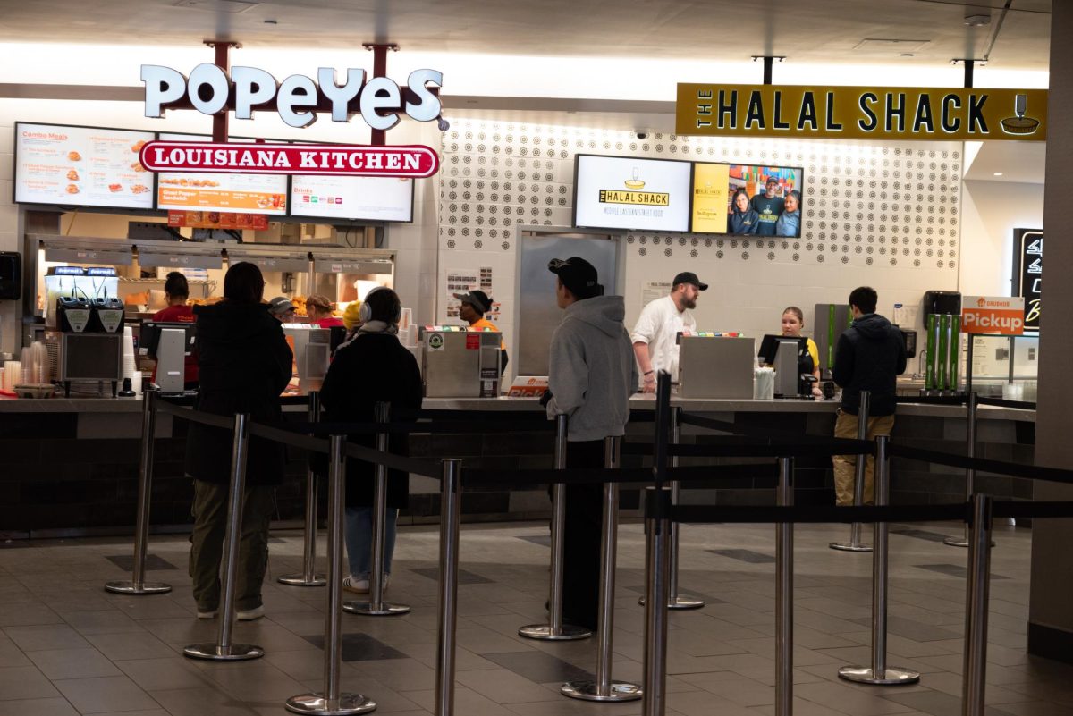 Students wait in line for Popeyes in Curry Student Center. The new dining plans eliminated meal exchanges for more dining dollars.