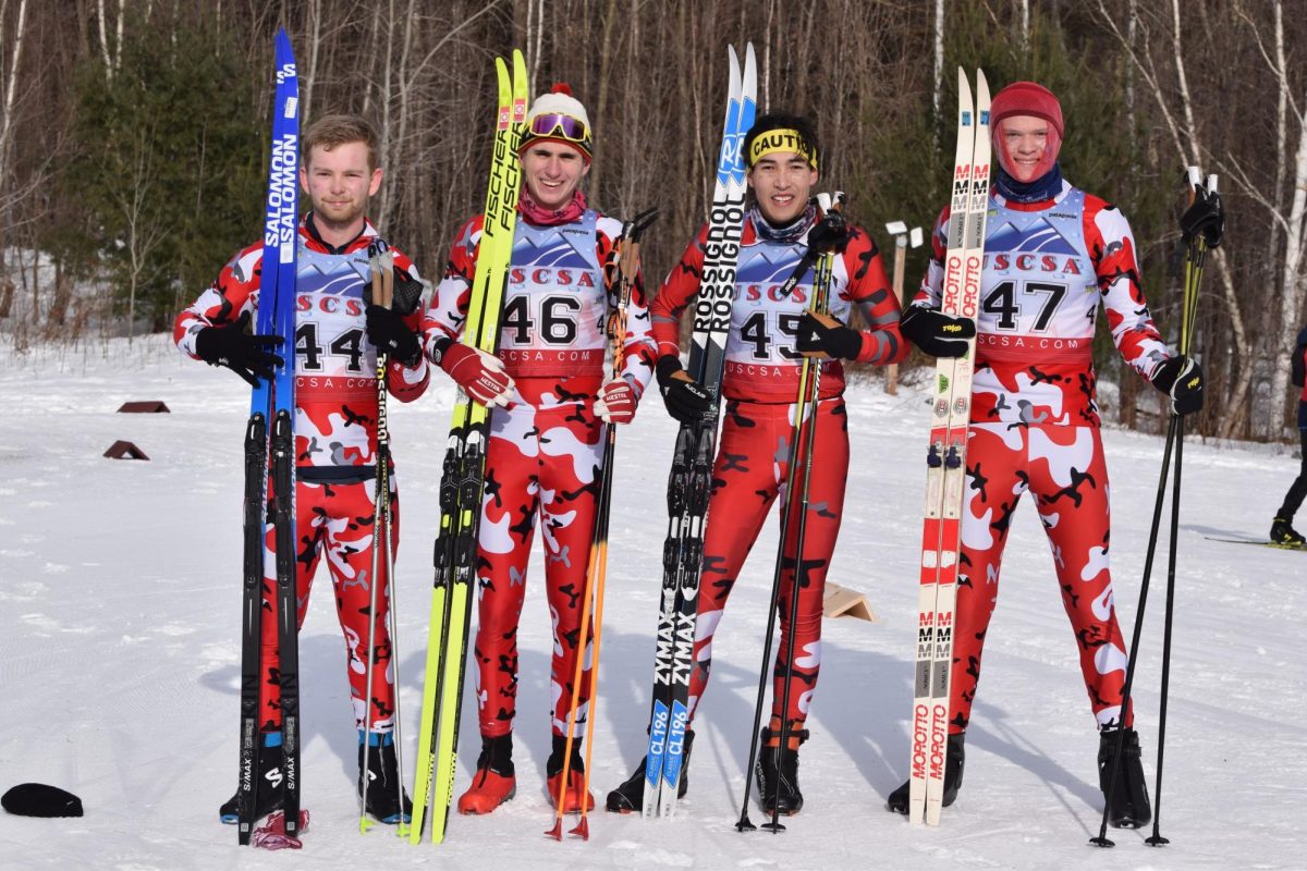 Nordic skiers Bergen Nelson, Joseph Stumpf, Ted Yee and Beck Labash (left to right) stand with their skiis at a competition. The club was founded in 2023 by Yee and Greta Goldade. Photo courtesy HUski Nordic Club.