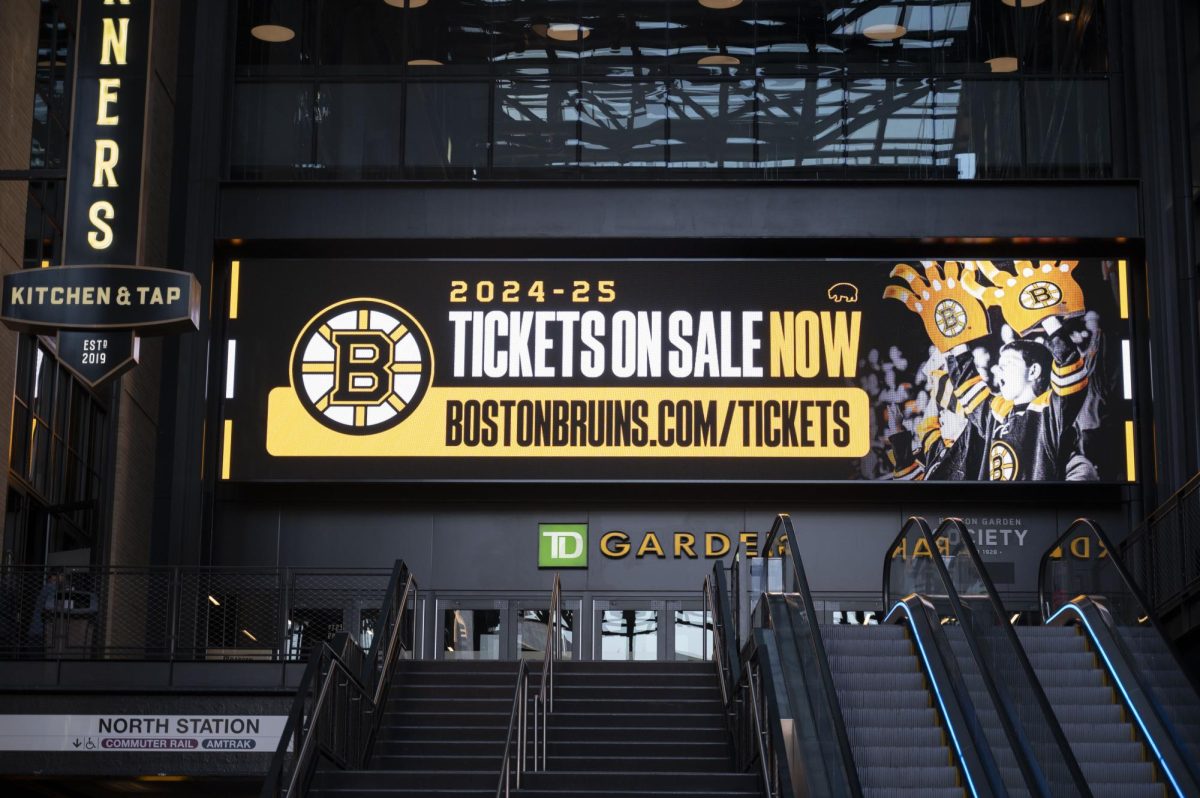 TD Garden advertises upcoming Bruins game, encouraging fans to buy tickets for the season. The Ruggles Orange Line station connected directly to TD Garden, making transportation accessible for students.