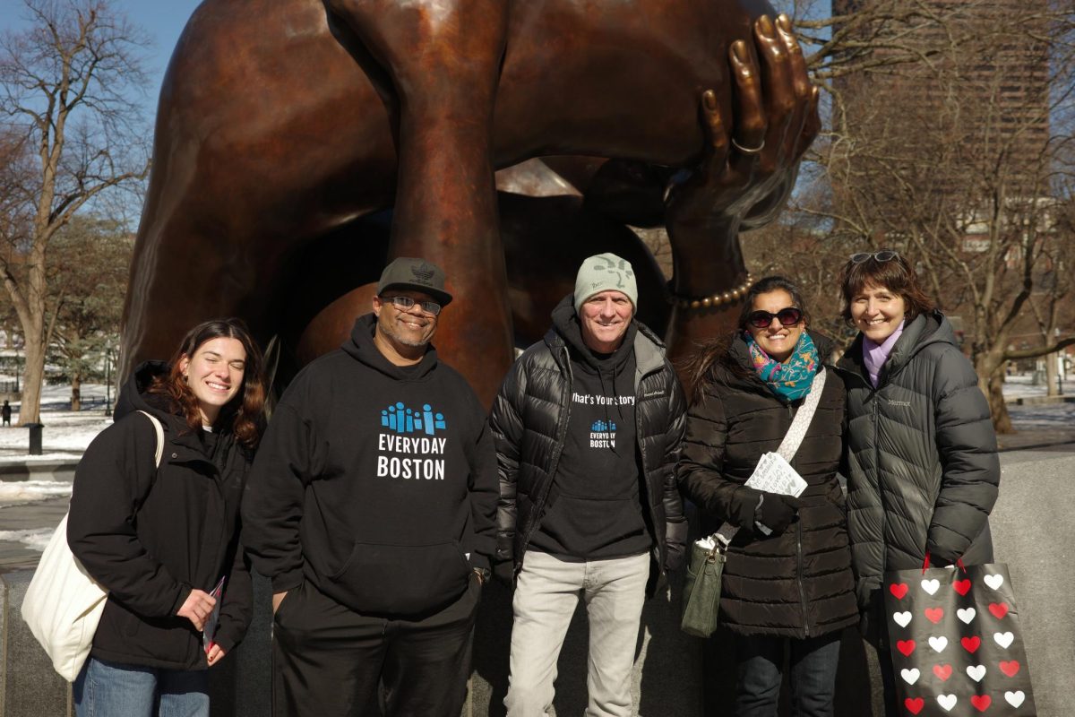 Everyday Boston representatives stand in front of the Embrace Memorial in Boston Common to distribute Valentine’s Day cards. The initiative aimed to show how small acts of kindness can foster a connected community amid growing uncertainties.