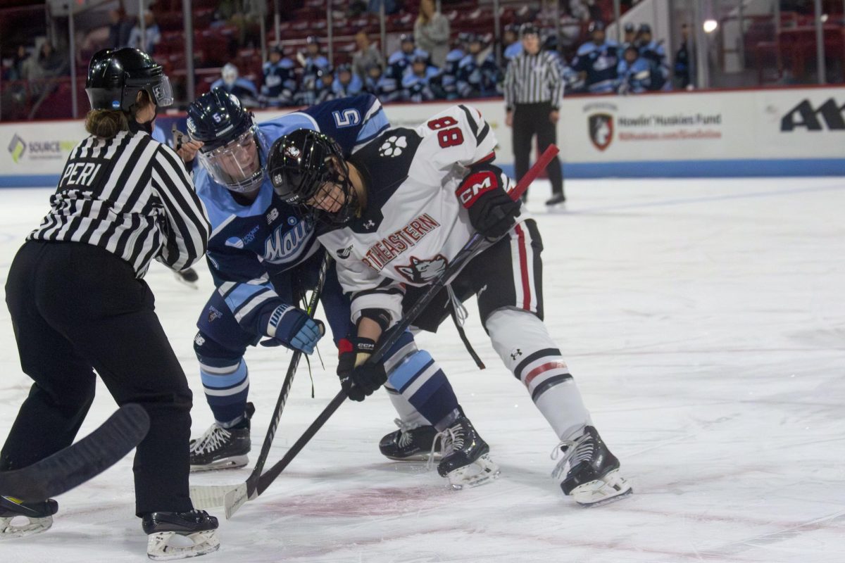 Senior forward Skylar Irving takes a faceoff against Maine. Nov. 15, 2024. The Huskies fell short against Maine during their third-to-last weekend of the season.