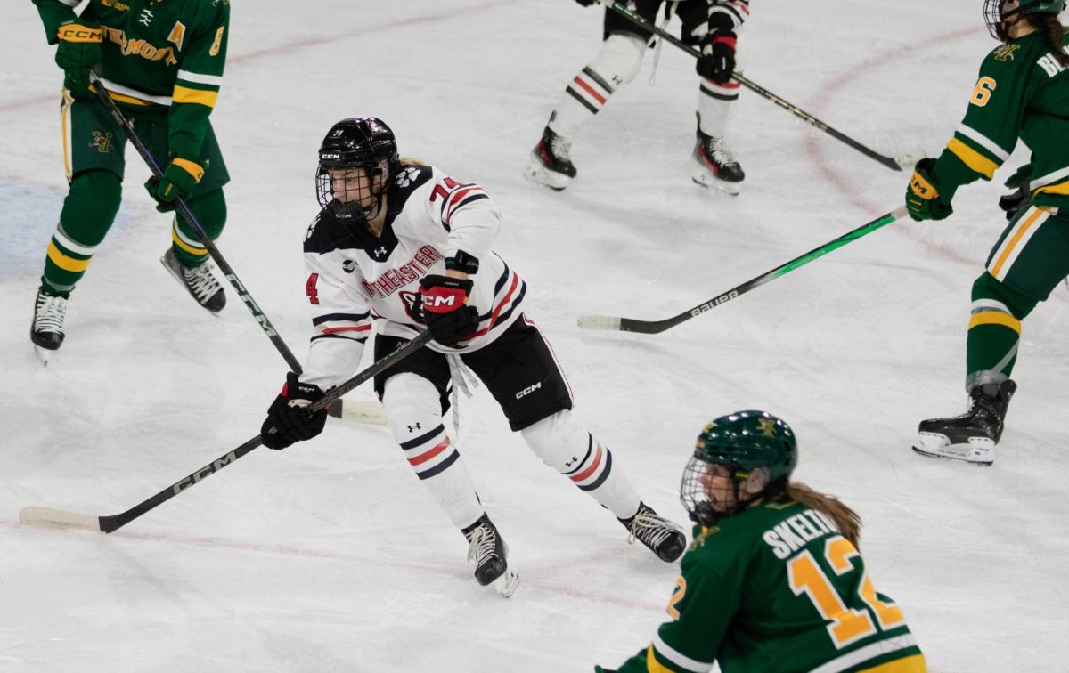 Jaden Bogden looks for the puck. The Huskies were rested going into the Vermont game but their failure to finish and a shorthanded goal in the third period earned the Catamounts a 1-0 victory. 