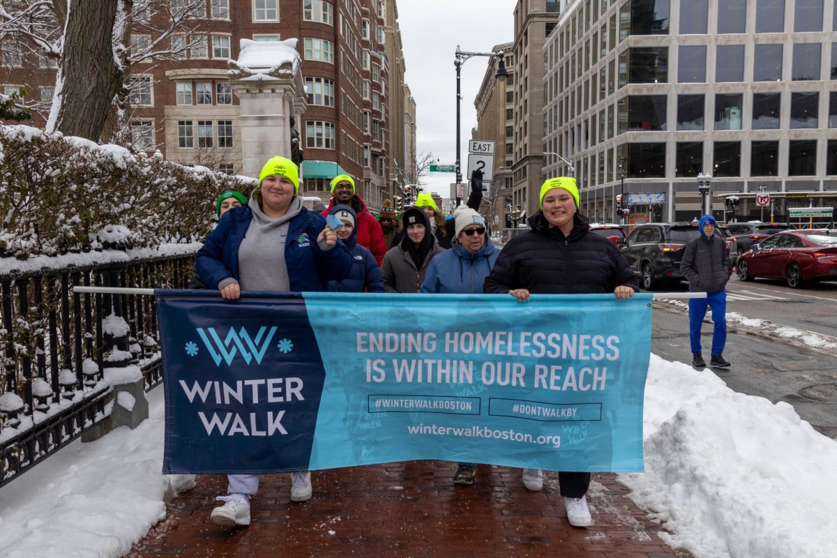 Participants of the 9th annual Winter Walk hold up a banner advocating for ending homelessness Feb. 9. Members of the NABB Homelessness Task Force joined thousands in walking around Boston Common to raise money to end homelessness.