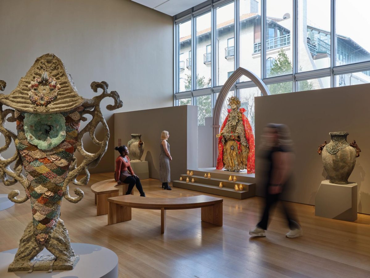 Museum goers sit and wander the Waters of the Abyss exhibit. The exhibit featured different mediums of art, from sculpture to intricate clothing. Photo courtesy Isabella Stewart Gardner Museum, Boston.