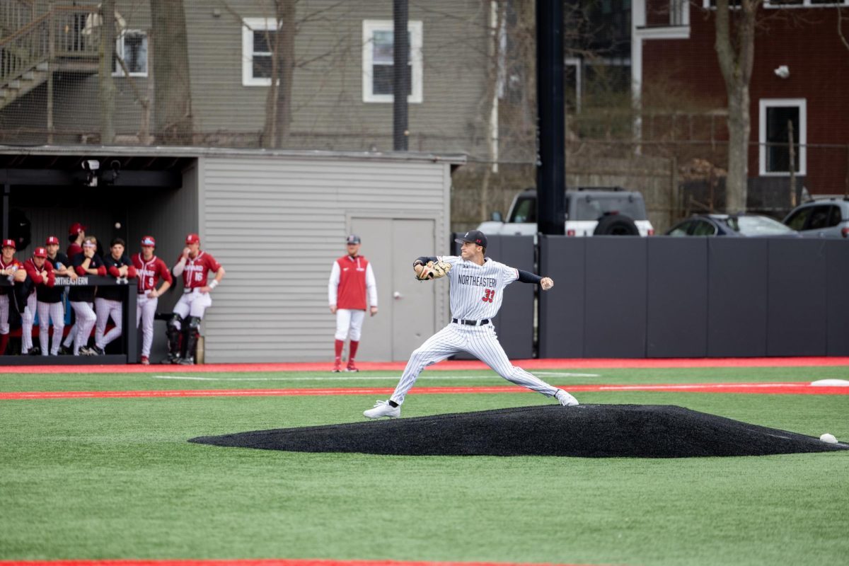 Jordan Gottesman throws a pitch. Northeastern baseball took a three game sweep against Harvard University March 14-16.