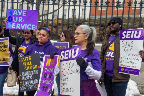 Members of the Service Employees International Union, or SEIU, protest Maura Healey's budget cuts. While the announcement of the budget focused on boosting transportation, cuts to healthcare came with mass layoffs and closures of facilities across the state.