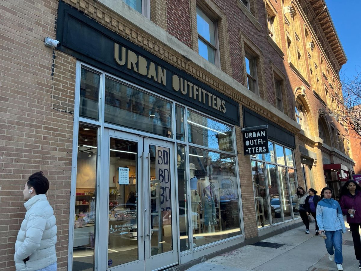 People walk by Urban Outfitters on Newbury Street. A Northeastern student was arrested after allegedly making a bomb threat in the store March 18.