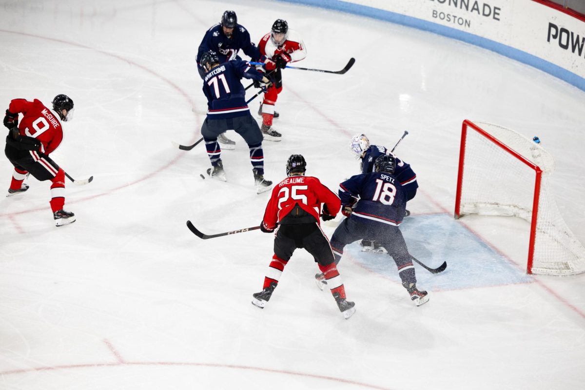 Northeastern scrambles to put a puck in the net. The Huskies lost to UConn Feb. 28 and March 1 2-5 and 1-7, respectively.