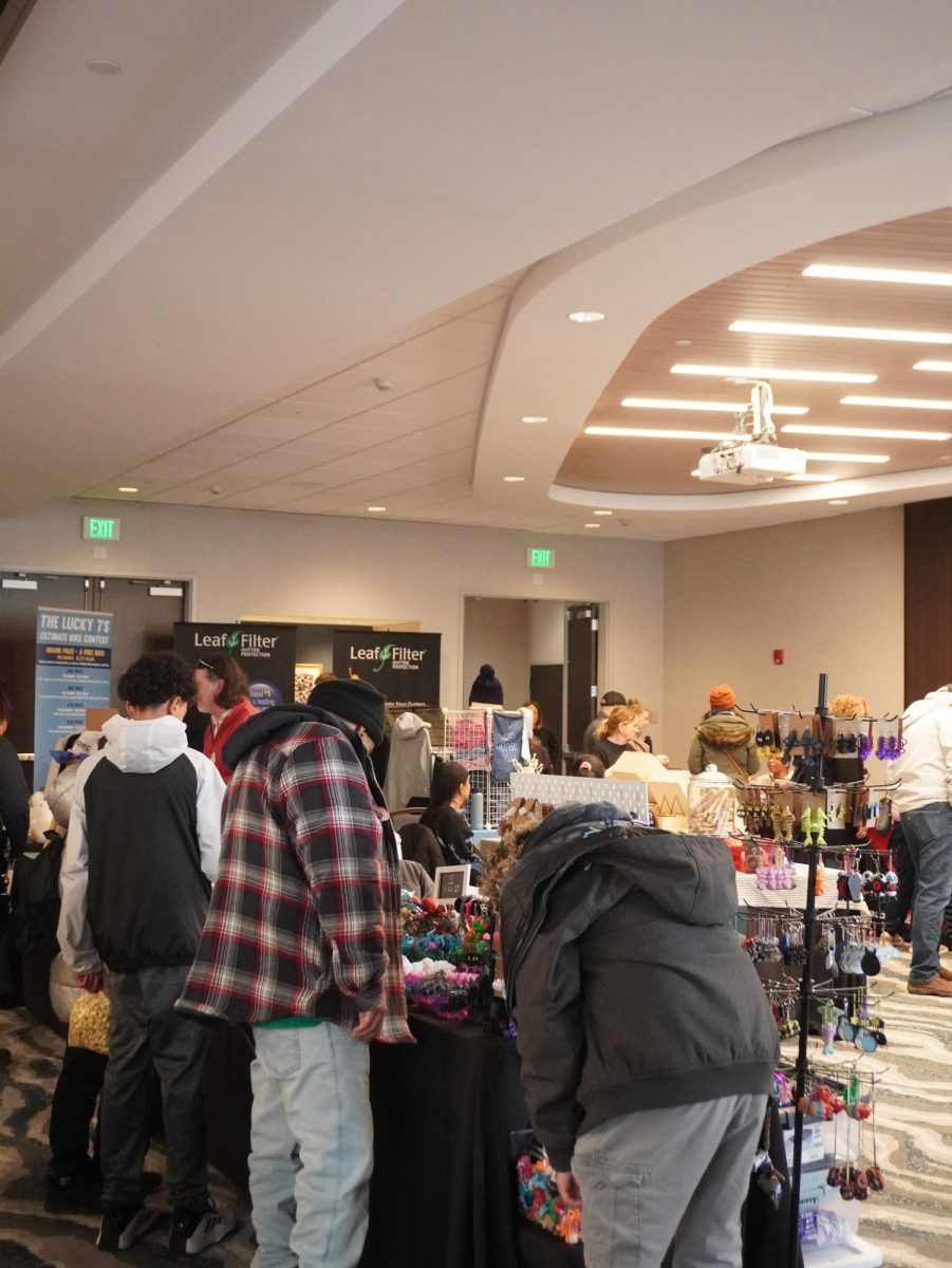 Attendees shop around inside the market area of Winter Wonderland. The market occupied the conference room of Springhill Suites.