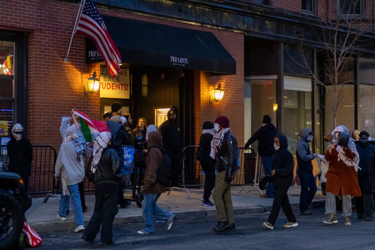 Pro-Palestine protesters rally outside Two Saints Tavern. The protest took place during a Hillel event.