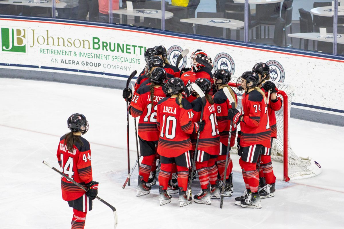 Captain Taze Thompson looks at her team after the loss. Despite winning the 2025 Beanpot tournament against Boston University, the Huskies lost to the Terriers 3-2 in overtime in the Hockey East Championship.