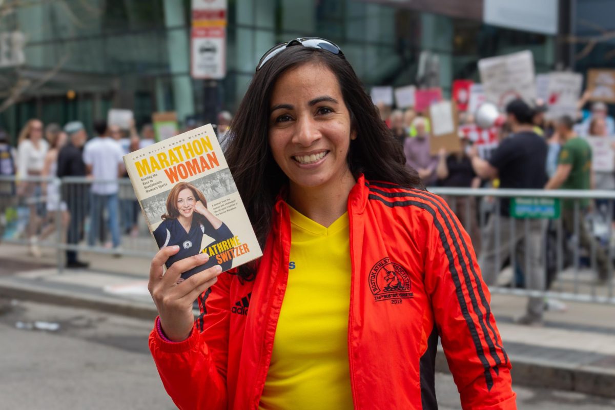 Crystal Chinea holds the book “Marathon Woman” by Kathrine Switzer April 19. Read more here.