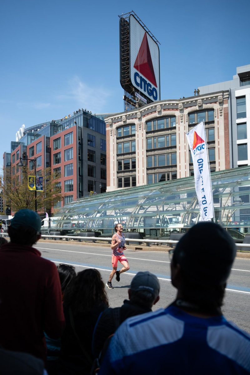 Landon Woollard runs along Commonwealth Avenue while crowds applaud from the sidelines April 21. Read more here.