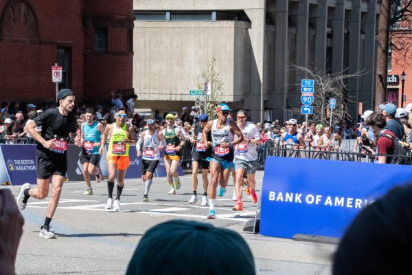 Runners make a turn during the 2024 Boston Marathon April 15. The annual race welcomed almost half a million spectators last year.