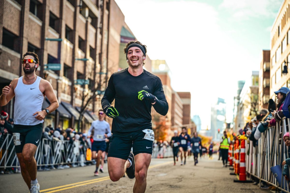 Charlie Adams runs in a race. Adams trained for the marathon with his older sister, Ellie Adams who is training for the Chicago Marathon. Photo courtesy Charlie Adams.