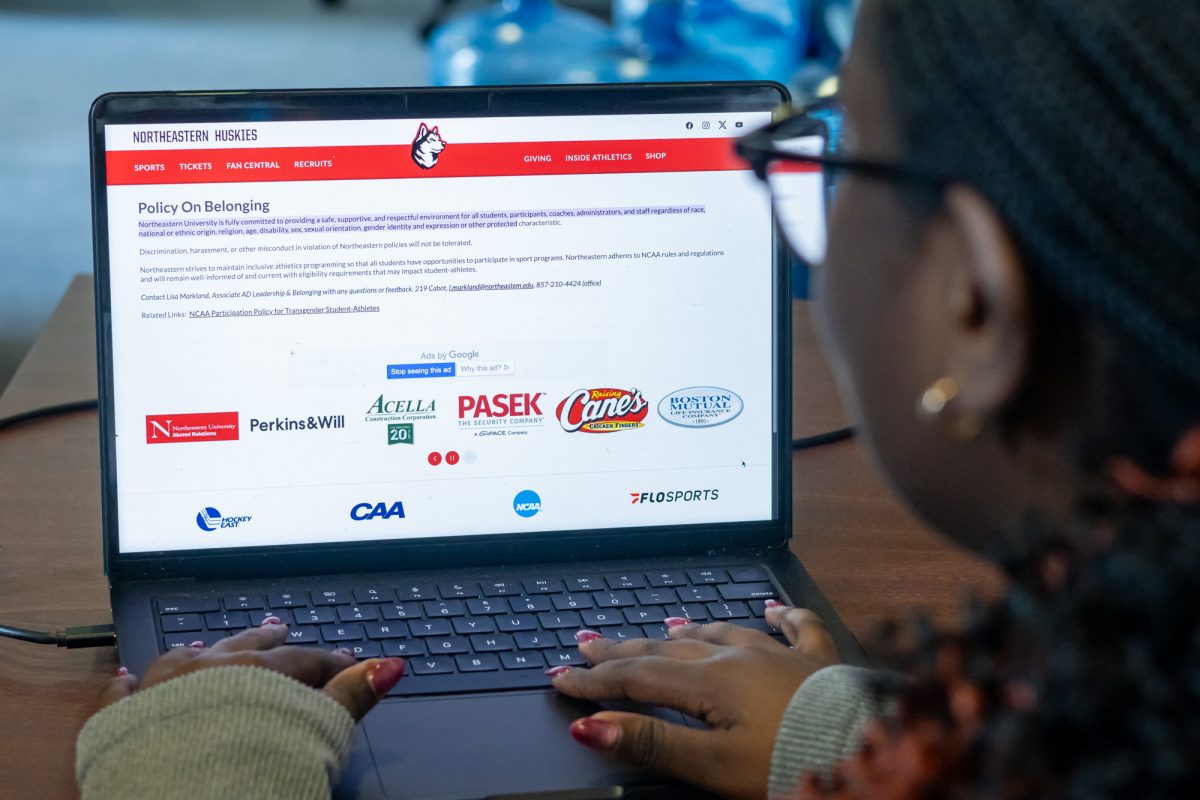 A student navigates the Northeastern Athletics Policy On Belonging page. Northeastern Athletics altered numerous policies, such as those regarding trans student-athletes and women's sports. 
