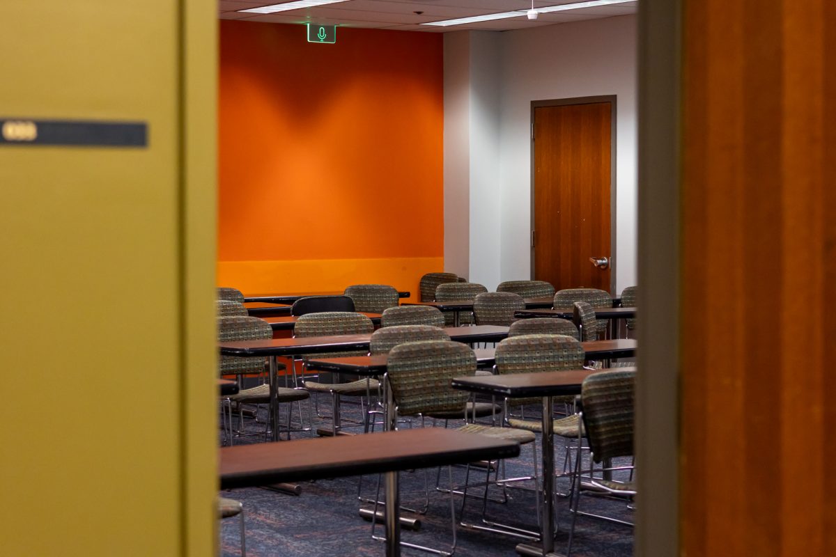 An open door leading to an empty Snell basement classroom. The lower level floors failed to provide cell service, but excelled in space.