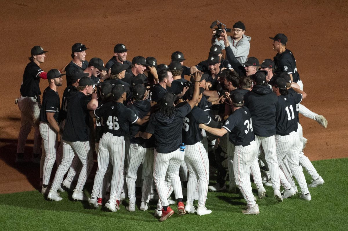 The Huskies celebrate their win April 30. Northeastern won the CAA regular season championship title.
