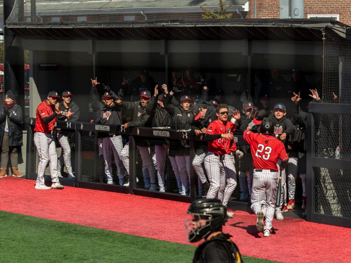 Carmelo Musacchia runs to the dugout March 23. Northeastern finished the regular season ranked at 19 in the country.