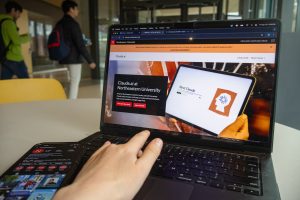 A student navigates Northeastern’s Claude AI webpage on a laptop. The university offered virtual workshops and livestream tutorials that taught students how to incorporate Claude into their academic studies.