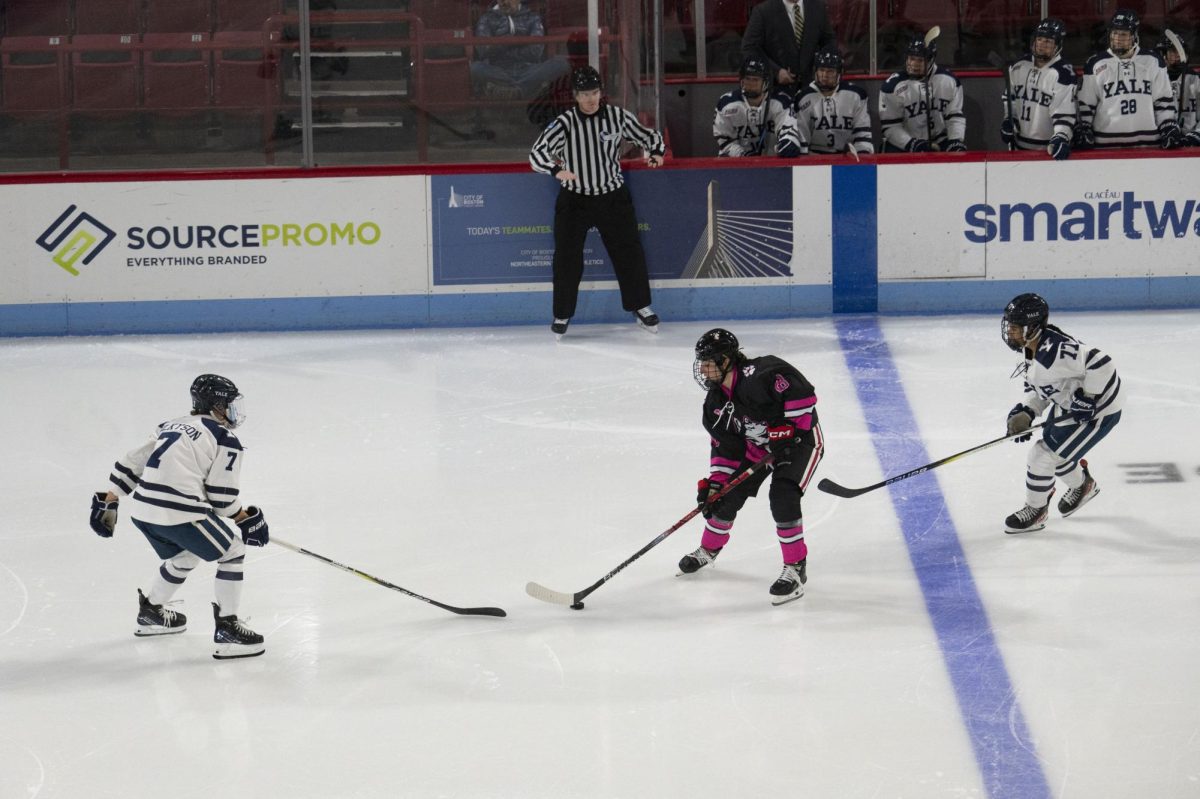 Skylar Irving moves the puck around her opponent Jan. 7. Irving announced she will be entering the PWHL Draft June 25. File photo Jessica Xing.