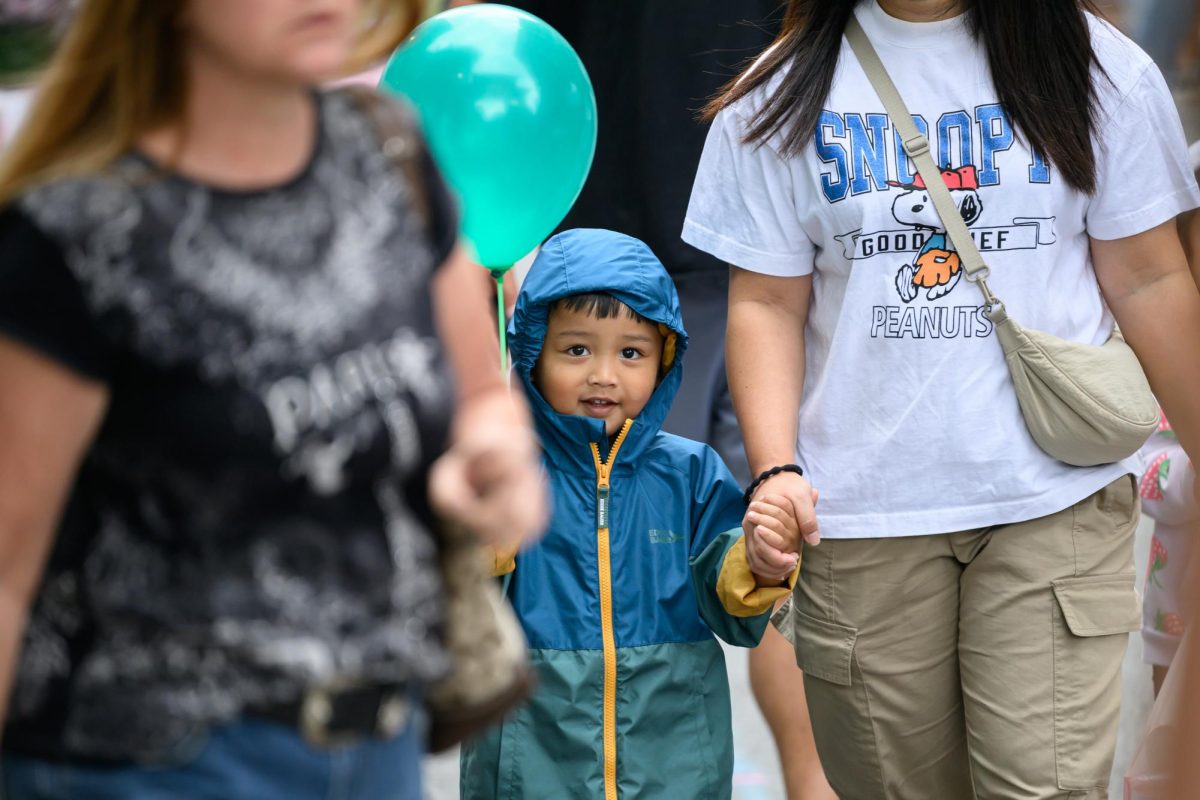 A child holds a balloon while watching the Chinatown Lantern Festival Sept. 13. Read more here.