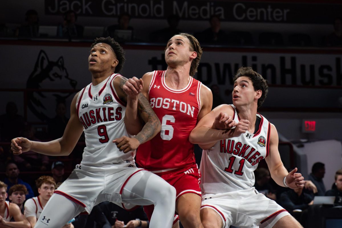 Freshman forward Ty Francis (left) and junior guard JB Frankel fight a Boston University player for the ball Nov. 3. Read more here.