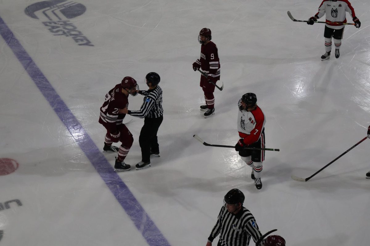 Tensions flare between Andy Moore (right) and UMass's Charlie Liberman (left). Despite Moore's unsportsmanlike conduct, Northeastern killed the penalty shot Dec. 8.