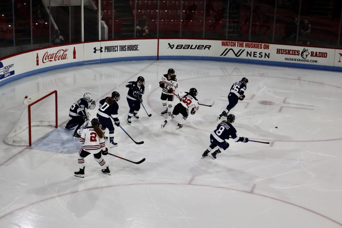 Northeastern tries to get the puck back after a chance to score Nov. 28. The Huskies split the weekend with Penn State, winning 3-2 Nov. 28 and losing 4-1 Nov. 29.