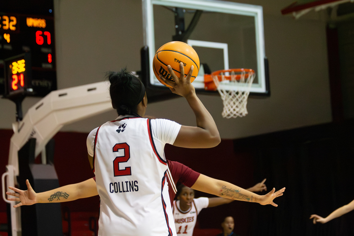 Camryn Collins looks to pass to an open teammate. Collins scored 12 points in the 71-52 loss against UMass Dec. 3