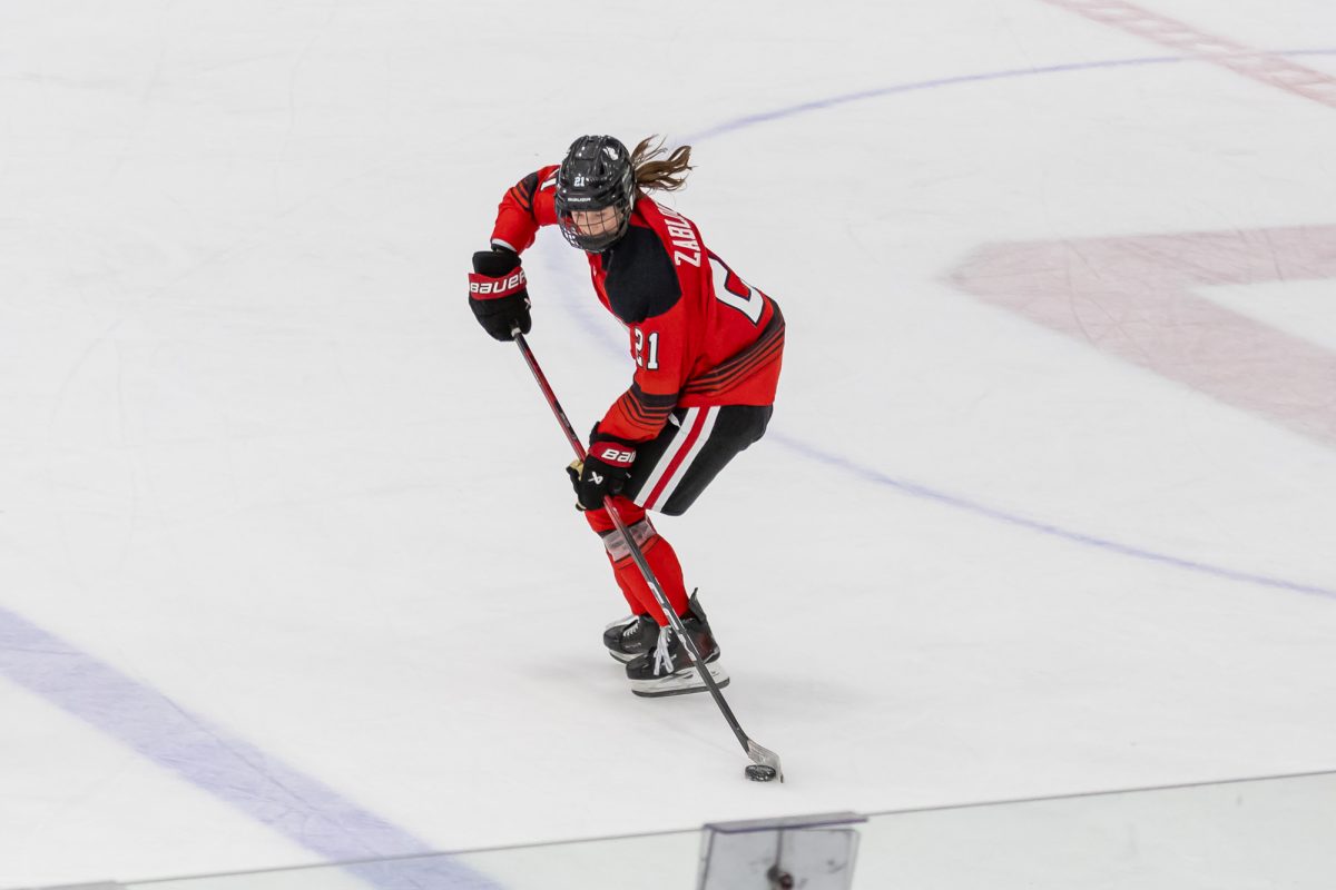 Stryker Zablocki rushes down the ice with the puck Jan. 13. Zablocki scored one goal and collected one assist in the 4-1 win over UConn Jan. 23.